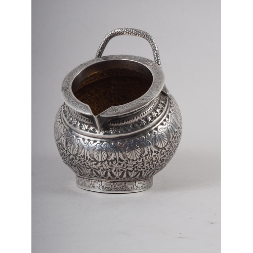 312 - An Oriental silver heavily chased, engraved and parcel gilt sugar bowl with later import marks, 4.6o... 