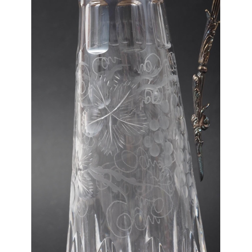 317 - A cut glass claret jug with engraved vine design and silver mounts