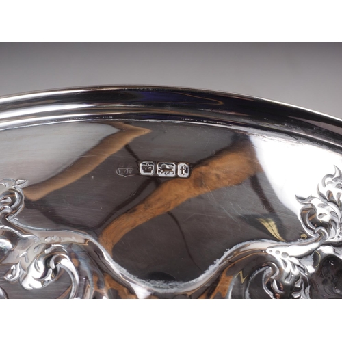 319 - A silver scroll embossed rosebowl, 17.41oz troy approx