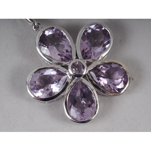 332 - A five stone floral pendant, set amethyst, setting and chain, stamped 925