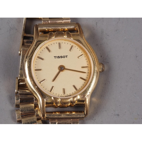 373 - A lady's Tissot wristwatch, on associated 9ct gold strap