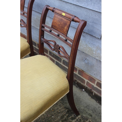 488 - A set of three 19th century carved mahogany bar back dining chairs with stuffed over seats, on turne... 