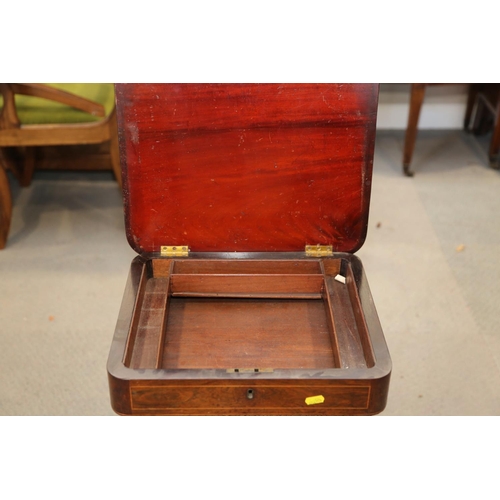 512 - A William IV rosewood work table with fold-over top and well, on turned column and quadruple splay s... 