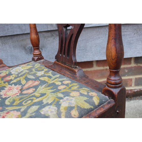 515 - A late 18th century carved mahogany corner elbow chair with needlepoint seat, on square taper and st... 