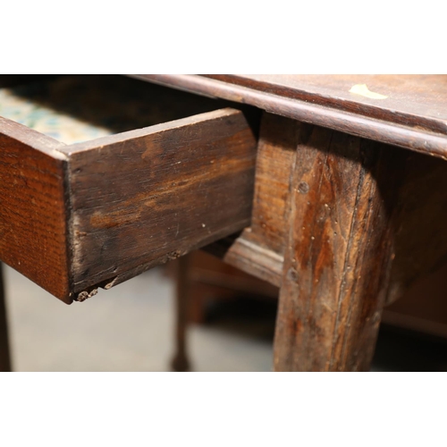 516 - An 18th century oak provincial side table, fitted one drawer, on turned supports and pad feet, 28