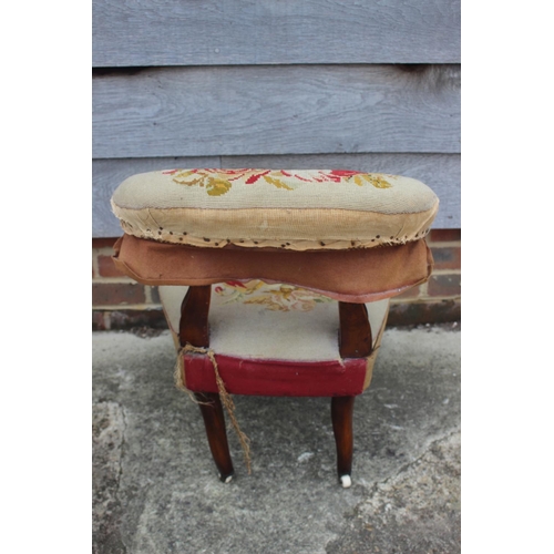 519 - A 19th century low seat nursing chair, on turned supports