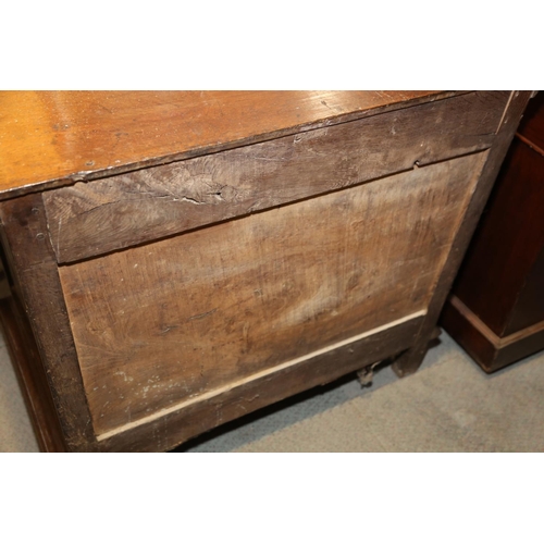 522 - An early 18th century oak chest of three long drawers with fielded panel fronts and brass drop handl... 