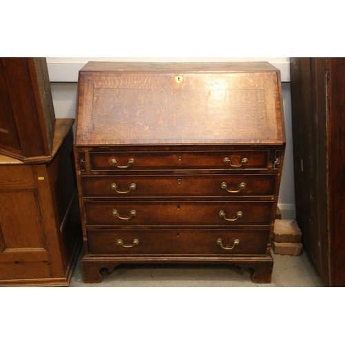 531 - A Georgian oak and mahogany banded fall front bureau, fitted interior with drawers and pigeonholes o... 