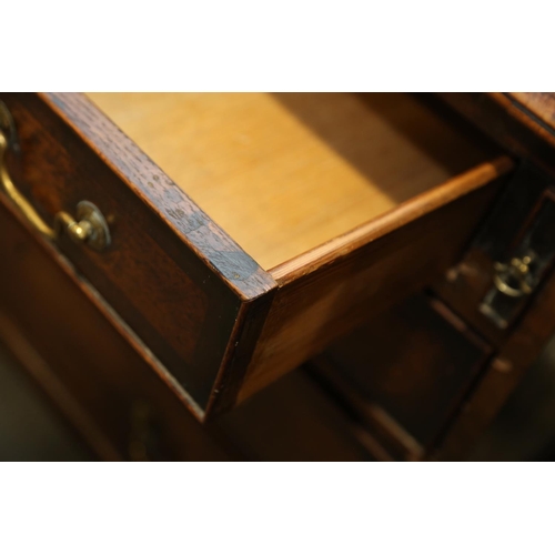 531 - A Georgian oak and mahogany banded fall front bureau, fitted interior with drawers and pigeonholes o... 