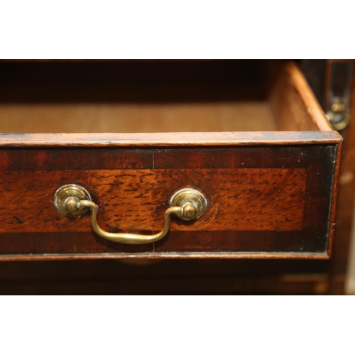 531 - A Georgian oak and mahogany banded fall front bureau, fitted interior with drawers and pigeonholes o... 