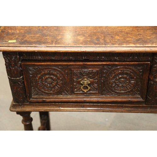 546 - An antique carved oak dresser base, fitted three drawers, on turned and stretchered supports, 57