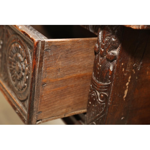 546 - An antique carved oak dresser base, fitted three drawers, on turned and stretchered supports, 57