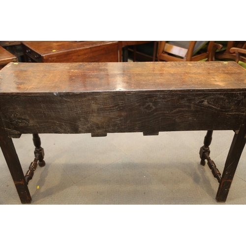 546 - An antique carved oak dresser base, fitted three drawers, on turned and stretchered supports, 57