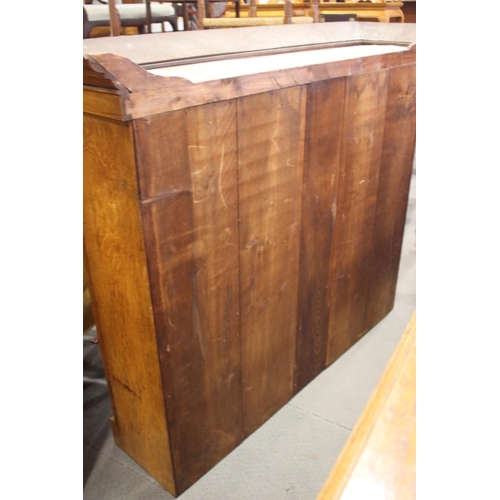 550 - A late 19th century light figured oak bookcase, the upper section fitted deep cornice over two leade... 