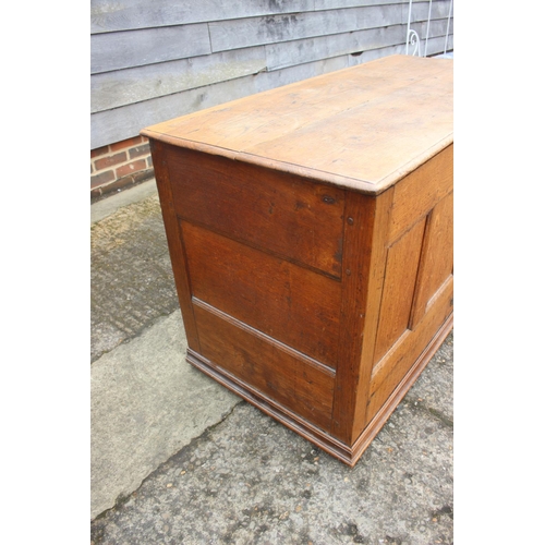 551 - A Georgian oak four-panel front coffer with faux drawers, on stile supports, 50