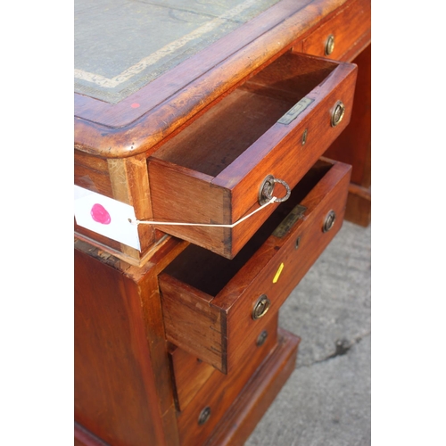 556 - A late 19th century mahogany double pedestal desk with tooled lined top, fitted nine drawers with br... 