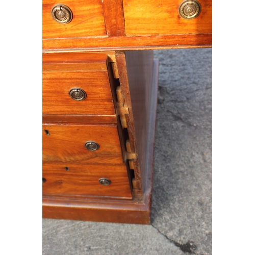 556 - A late 19th century mahogany double pedestal desk with tooled lined top, fitted nine drawers with br... 