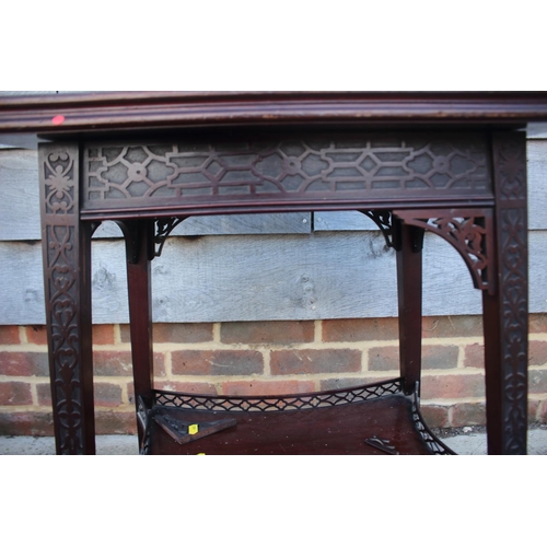 558 - A late 19th century carved mahogany fretwork two-tier patience table, on splay supports, 20