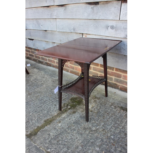 558 - A late 19th century carved mahogany fretwork two-tier patience table, on splay supports, 20