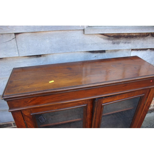 559 - A 19th century walnut bookcase enclosed two glazed panel doors, on block base, 36