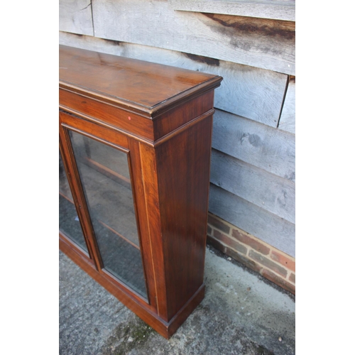 559 - A 19th century walnut bookcase enclosed two glazed panel doors, on block base, 36