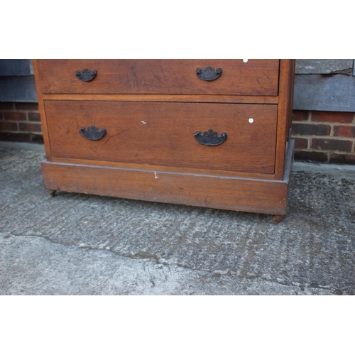 560 - A late 19th century oak chest of four short and three long graduated drawers, on later castored supp... 