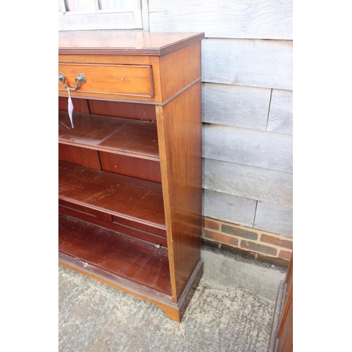 561 - A Maples late 19th century walnut book case, fitted two drawers over open shelves, on bracket feet, ... 