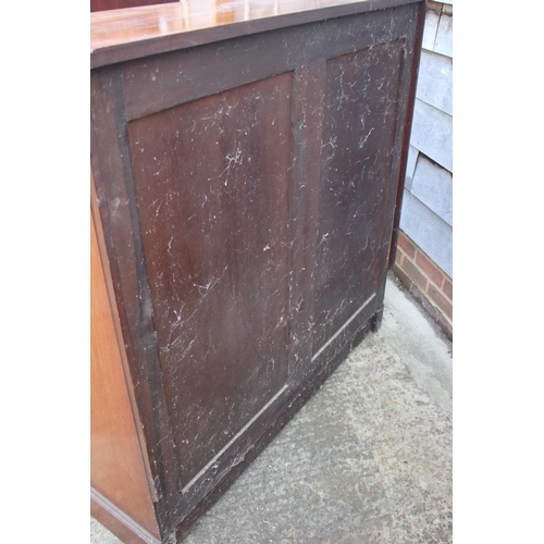 561 - A Maples late 19th century walnut book case, fitted two drawers over open shelves, on bracket feet, ... 