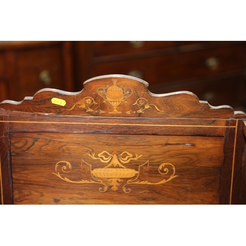 596 - An Edwardian rosewood and inlaid writing desk, fitted two cupboards over two drawers, on square tape... 