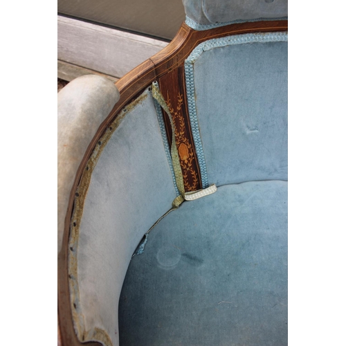 597 - An Edwardian rosewood and inlaid tub-shape chair, upholstered in a blue velour, on square taper supp... 