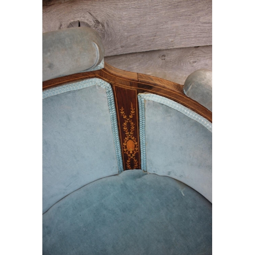 597 - An Edwardian rosewood and inlaid tub-shape chair, upholstered in a blue velour, on square taper supp... 