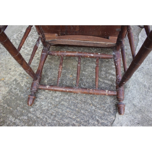 604 - An Arts & Crafts elm and ash low occasional table with spindle sides and turned supports, 42 1/2