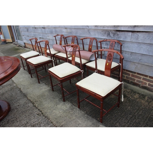 607 - A Chinese hardwood circular dining table, fitted four frieze drawers, on faux bamboo cluster column,... 