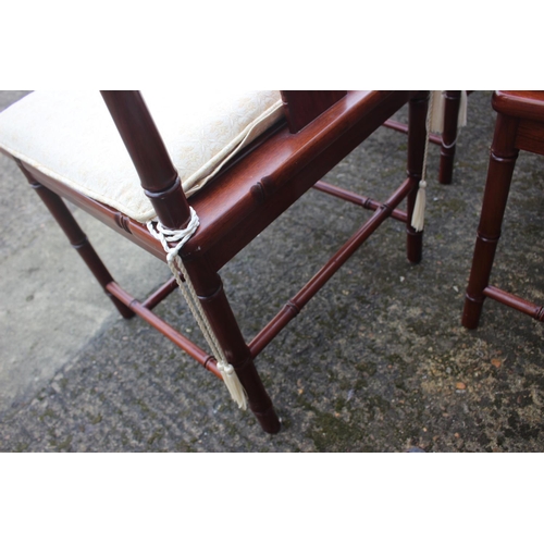 607 - A Chinese hardwood circular dining table, fitted four frieze drawers, on faux bamboo cluster column,... 