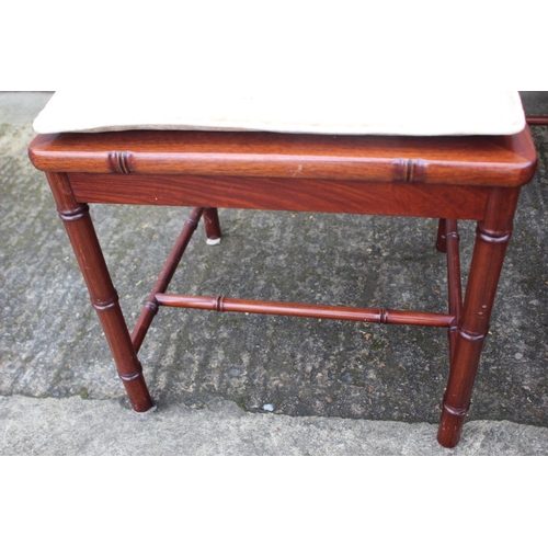 607 - A Chinese hardwood circular dining table, fitted four frieze drawers, on faux bamboo cluster column,... 