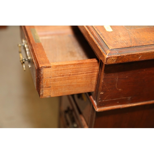 640 - An Edwardian walnut double pedestal desk with leatherette inset top, fitted nine drawers, 48