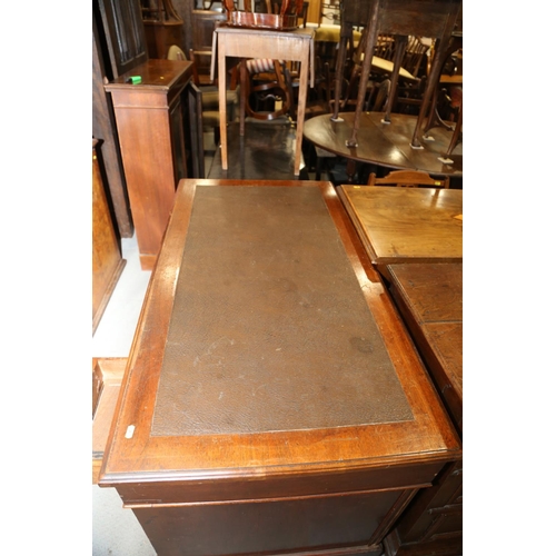 640 - An Edwardian walnut double pedestal desk with leatherette inset top, fitted nine drawers, 48