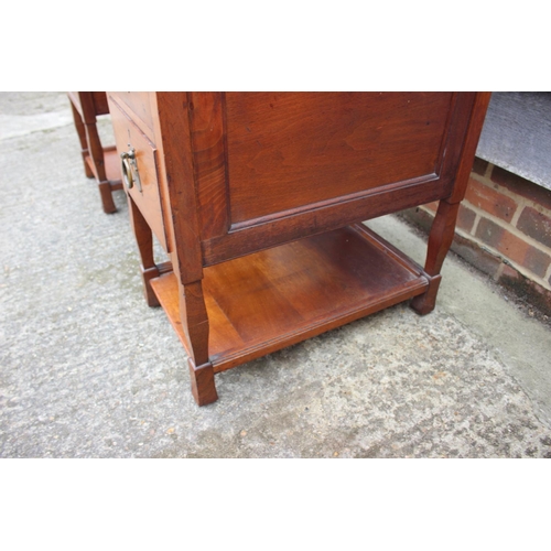 654 - An Arts & Crafts walnut break bowfront double pedestal desk with tooled lined top, fitted seven draw... 