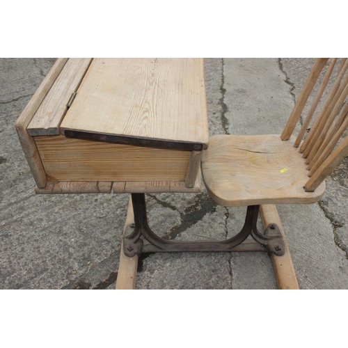 665 - A McCarthy Brothers cast iron and pine school desk with attached chair, 22