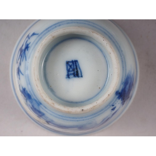 96 - A Chinese porcelain blue and white tea bowl, decorated mythical beasts and clouds with four-characte... 