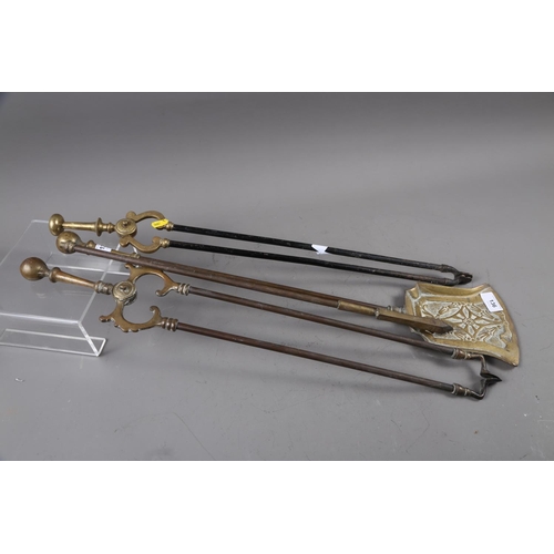 136 - A set of Edwardian matched brass and steel fire irons