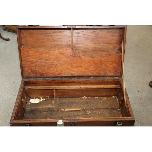 161 - A craftsman's metal bound travelling tool chest with part fitted interior and black japanned carry h... 