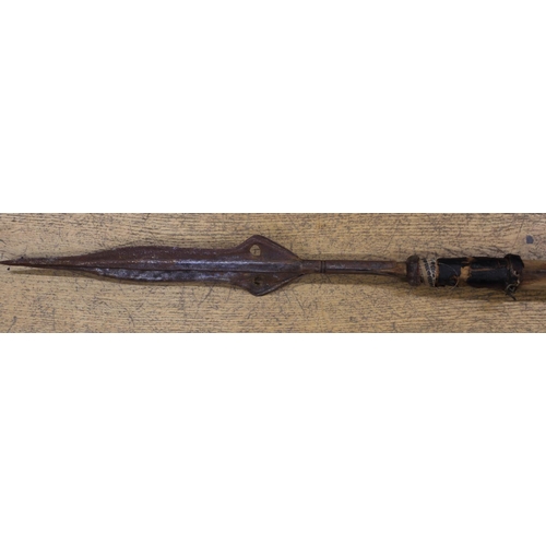 177 - An African spear with steel point and hidebound shaft, 68