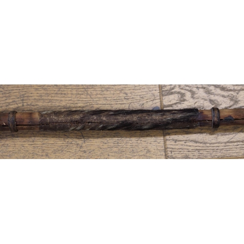 177 - An African spear with steel point and hidebound shaft, 68