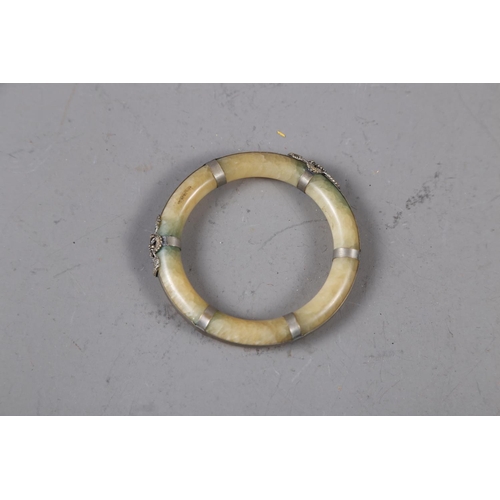 336 - A jade and white metal mounted bangle, a jade, lapis and glass necklace, a gilt metal bangle and a s... 