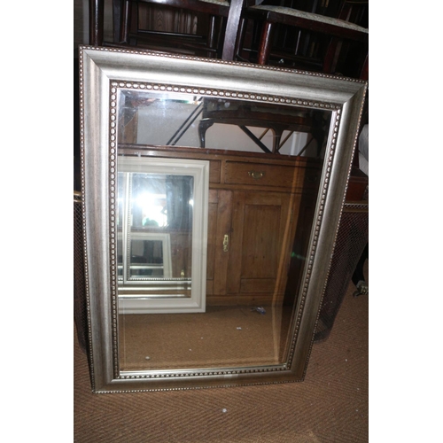 573 - A silvered frame wall mirror with bevelled plate, 23