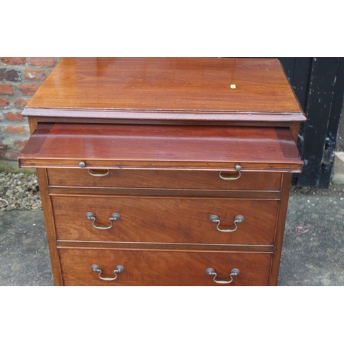 614 - A bachelor's mahogany chest of three long graduated drawers with brushing slide over, on bracket fee... 