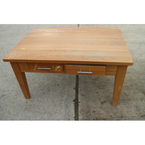 619 - A light oak coffee table, fitted four drawers, on square taper supports, 36