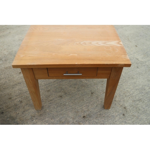 619 - A light oak coffee table, fitted four drawers, on square taper supports, 36