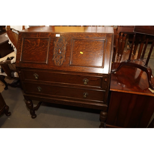 654 - An Arts & Crafts walnut break bowfront double pedestal desk with tooled lined top, fitted seven draw... 